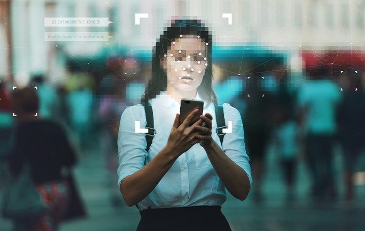 Woman on her mobile in a crowded street showing artificial intellignece facial recognition