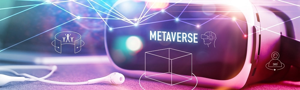 White and black virtual reality headset with the word Metaverse on the front on a table next to a set of wired white earphones, highlighting some of the upcoming digital design trends
